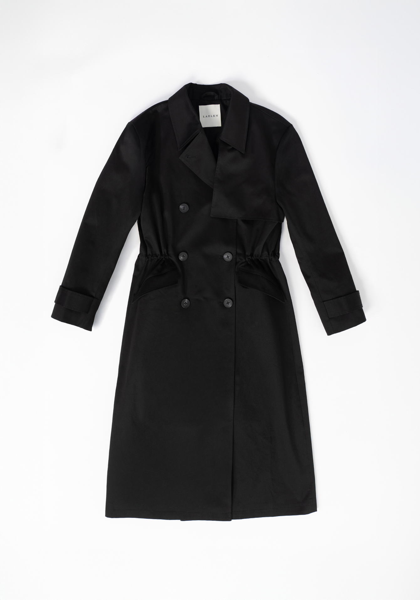 Black trench coat on a white background - flatlay