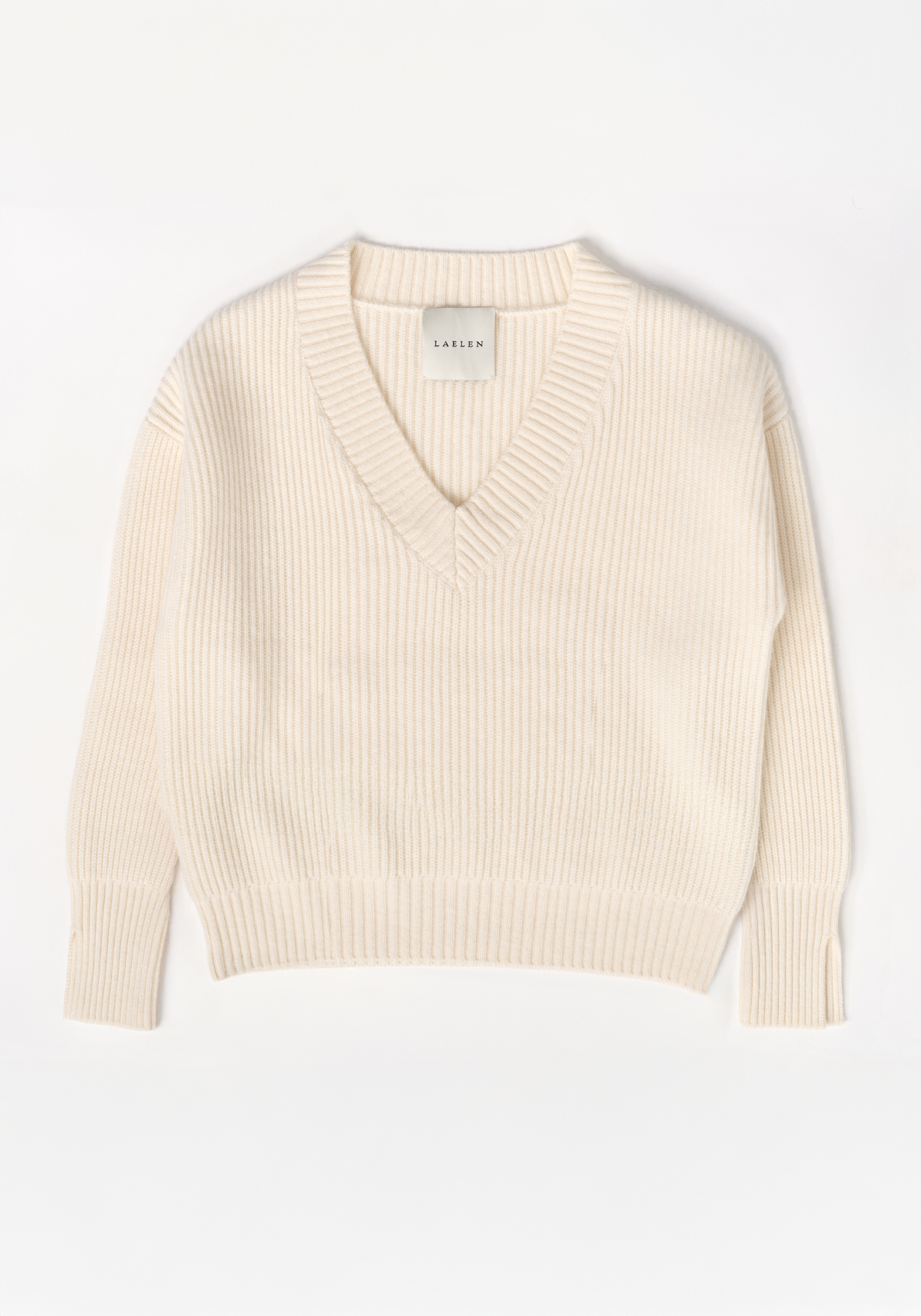 Cream-colored sweater on a white background with 'Laelen' branding. Flat lay